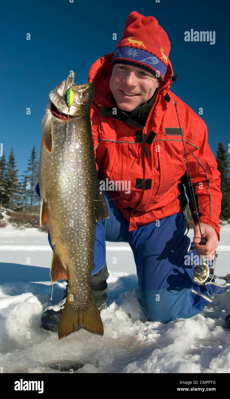 Man holding a Splake Ice Fishing, Wawa, Ontario Stock Photo