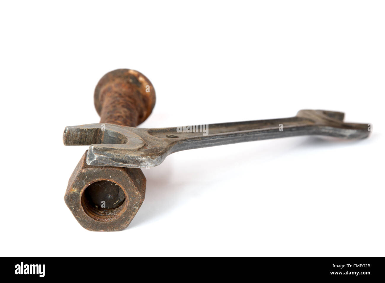 Wrench and rusty bolt with nut on a white background Stock Photo - Alamy