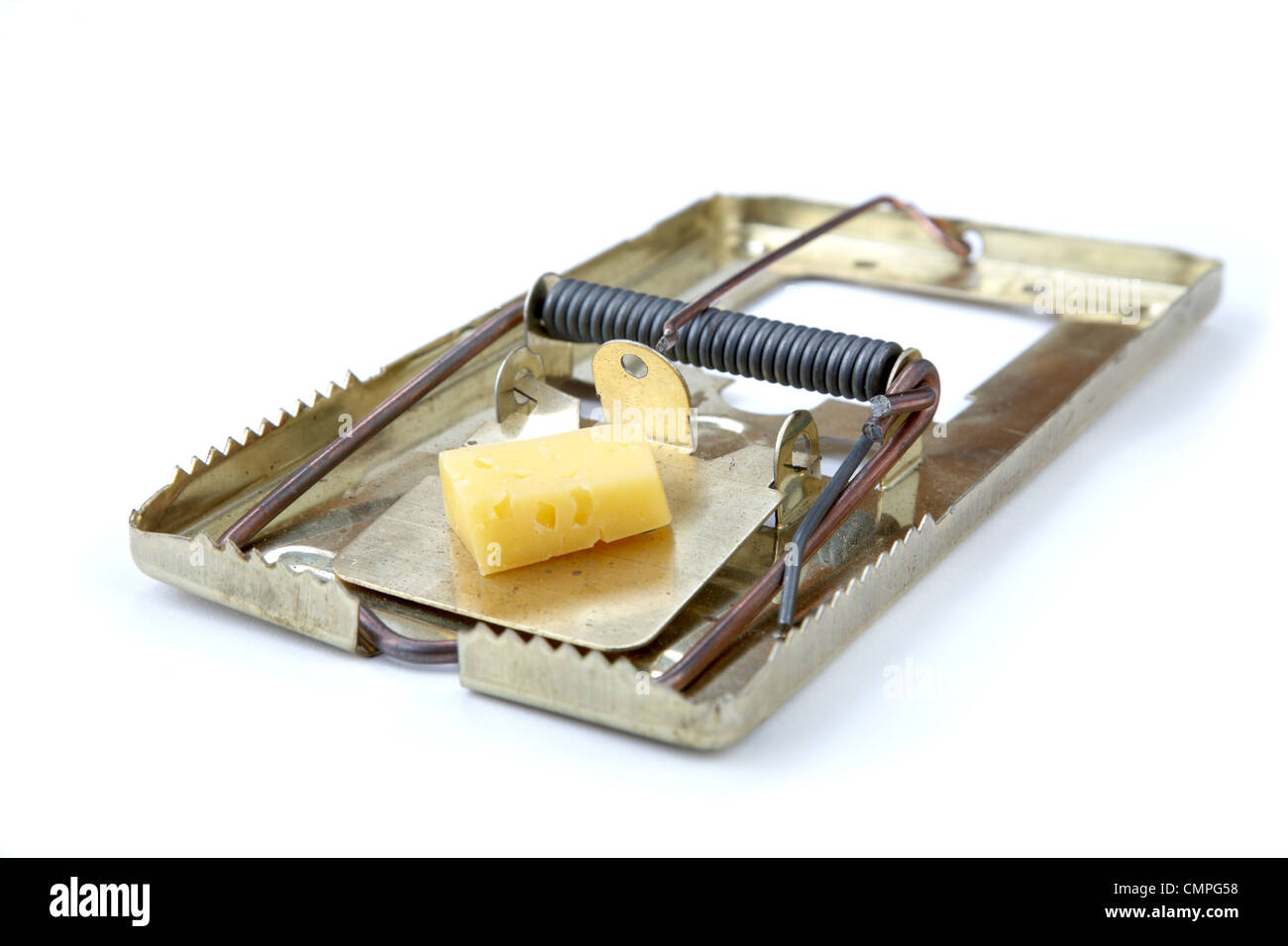 metallic mousetrap with cheese on a white background Stock Photo