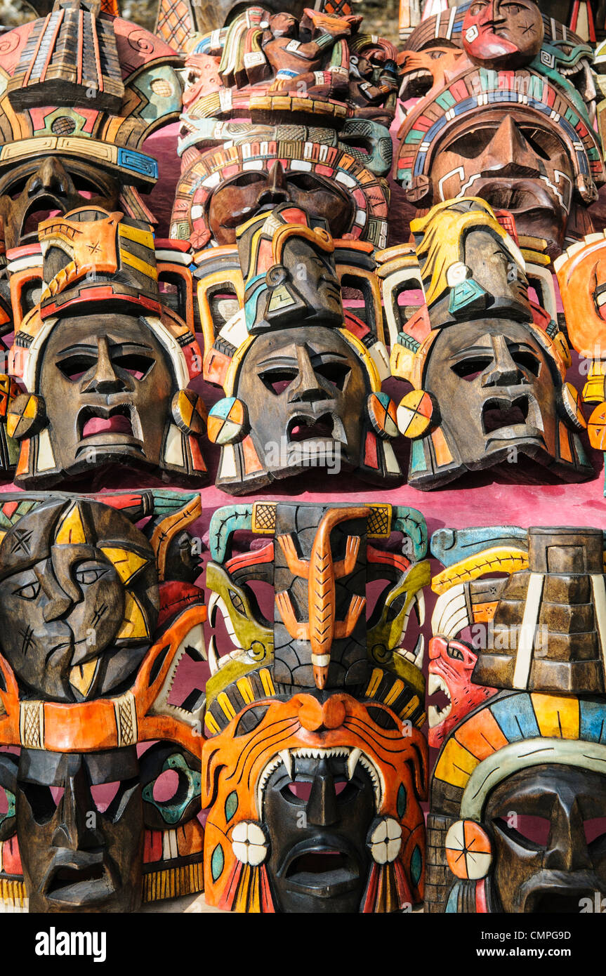 CHICHEN ITZA, Mexico - Market stalls selling wooden Mayan masks and other local souvenirs and handicrafts to tourists visiting Chichen Itza Mayan ruins archeological site in Mexico. Stock Photo