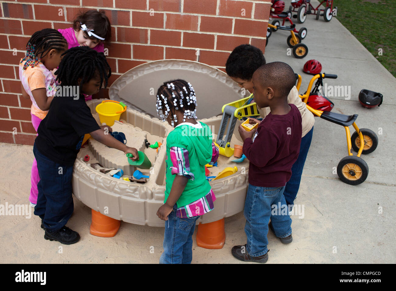 Children playing with a sand box Stock Photo - Alamy