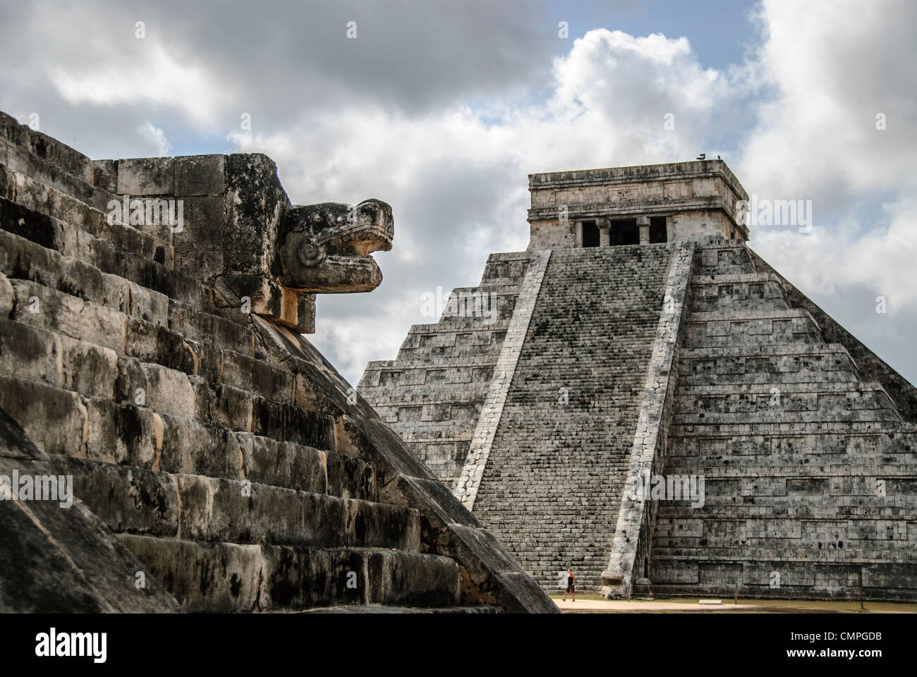 CHICHEN ITZA, Mexico - Temple of Kukulkan (El Castillo) at Chichen Itza Archeological Zone, ruins of a major Maya civilization city in the heart of Mexico's Yucatan Peninsula. At left, the building is known as the Venus Platform. Stock Photo