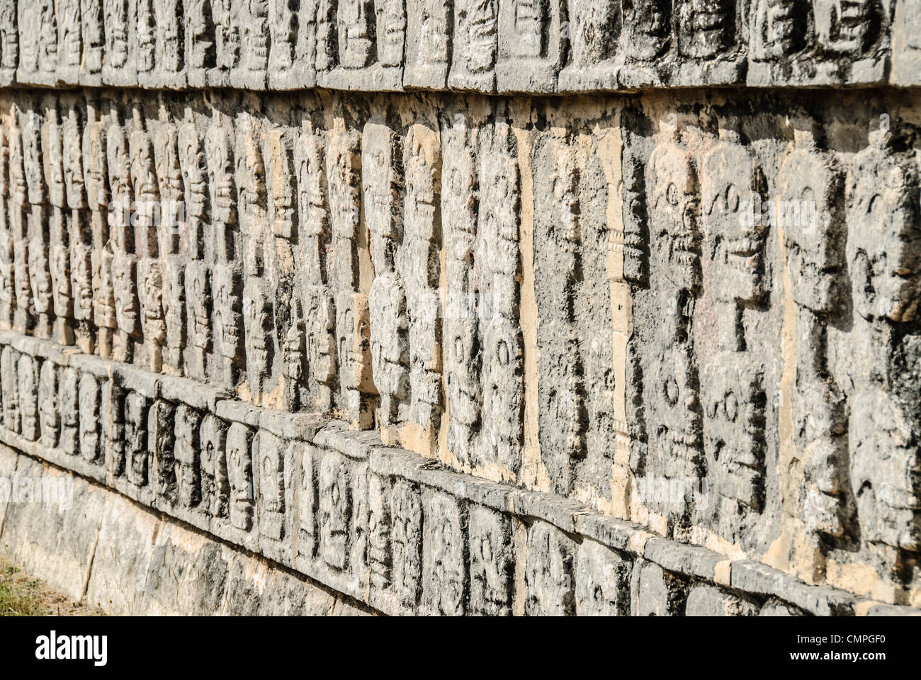 CHICHEN ITZA, Mexico - Depiction of skulls carved in a stone wall at Chichen Itza, Mexico. Stock Photo