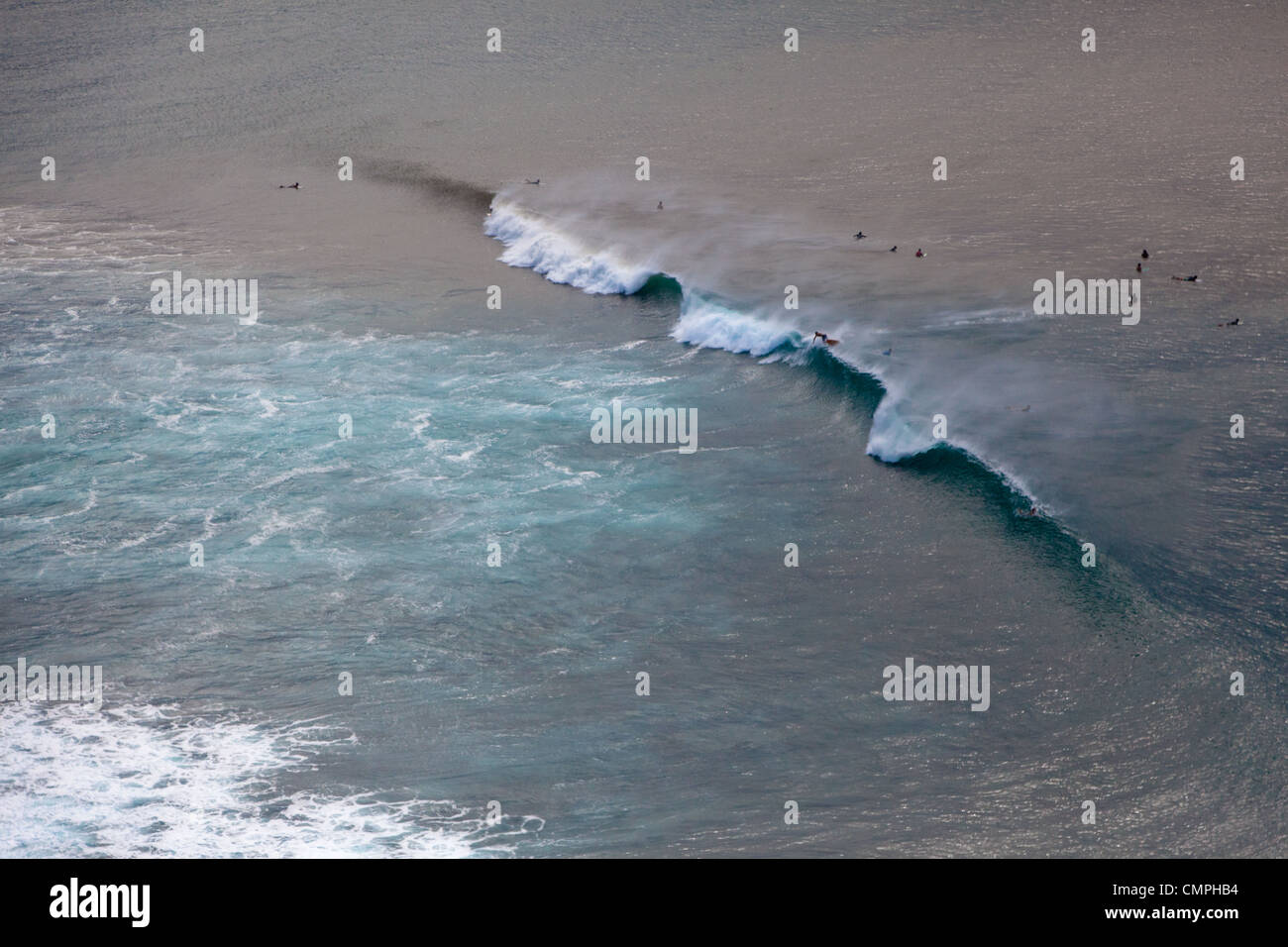 Aerial view of surfers in the lineup on the north shore of Oahu, Hawaii. Stock Photo