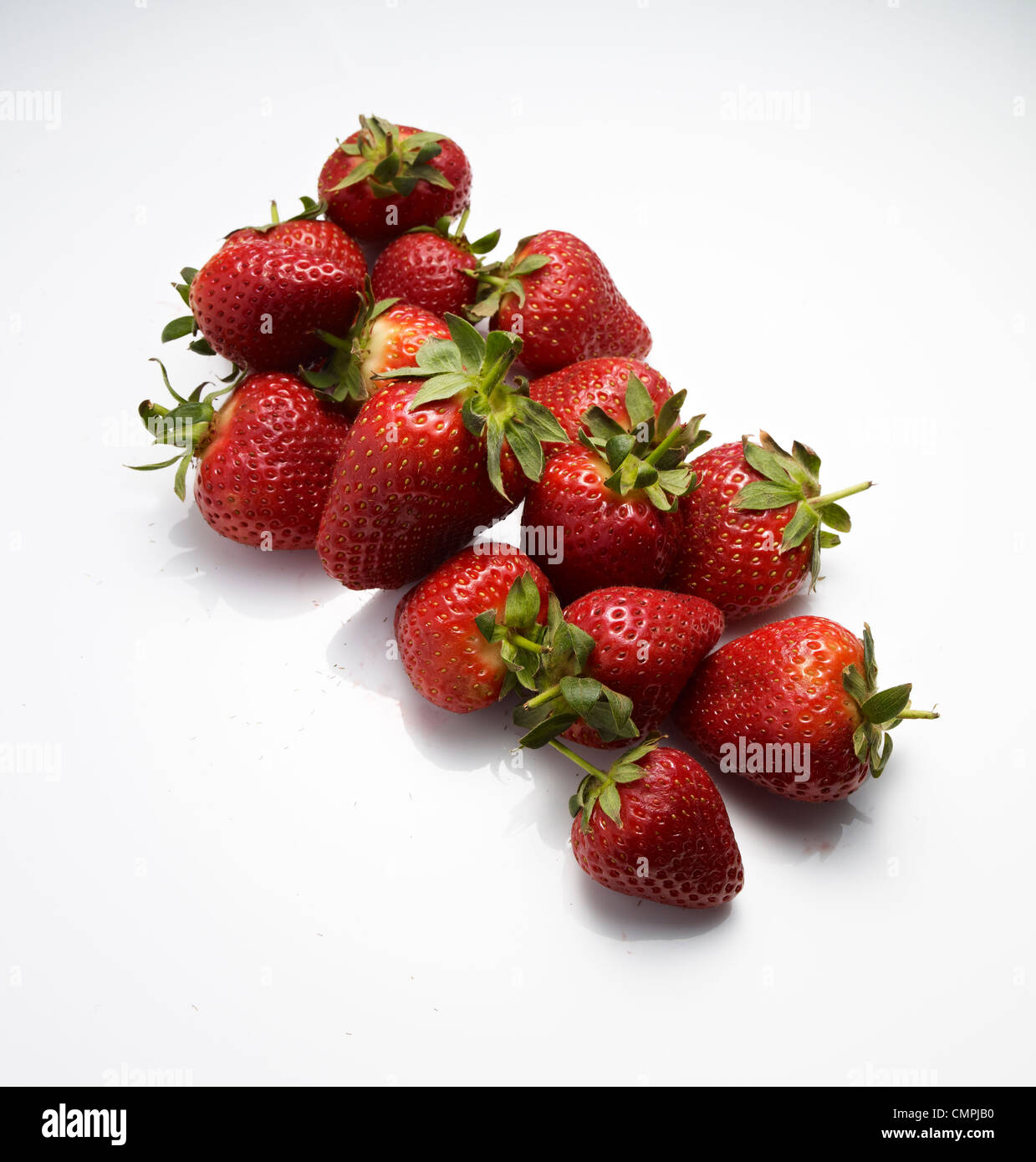 strawberries on white perspex Stock Photo
