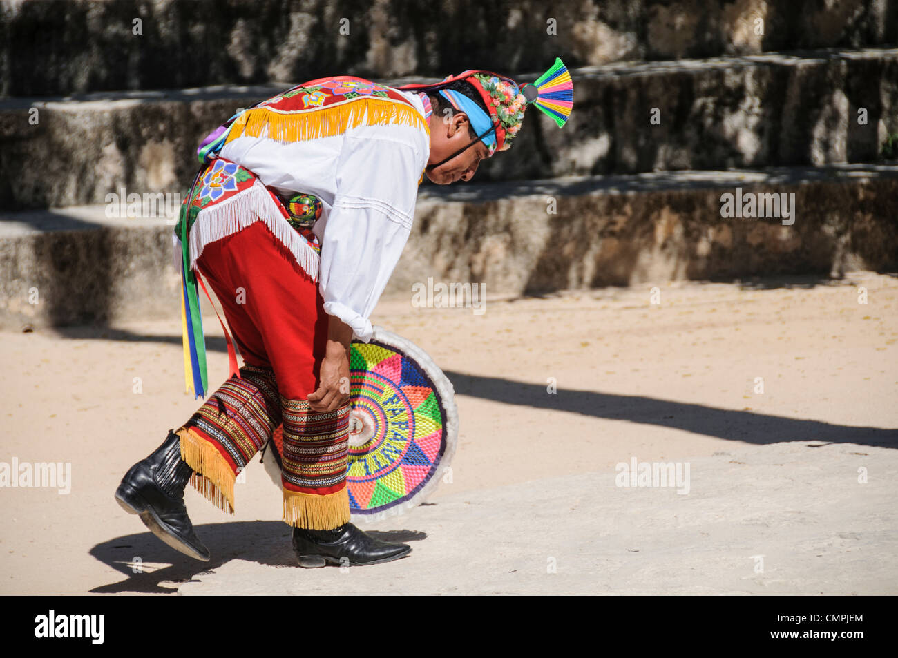 A dancer in traditional costume performing a Maya dance at Xcarat Maya theme park south of Cancun and Playa del Carmen on Mexico's Yucatana Peninsula. Stock Photo