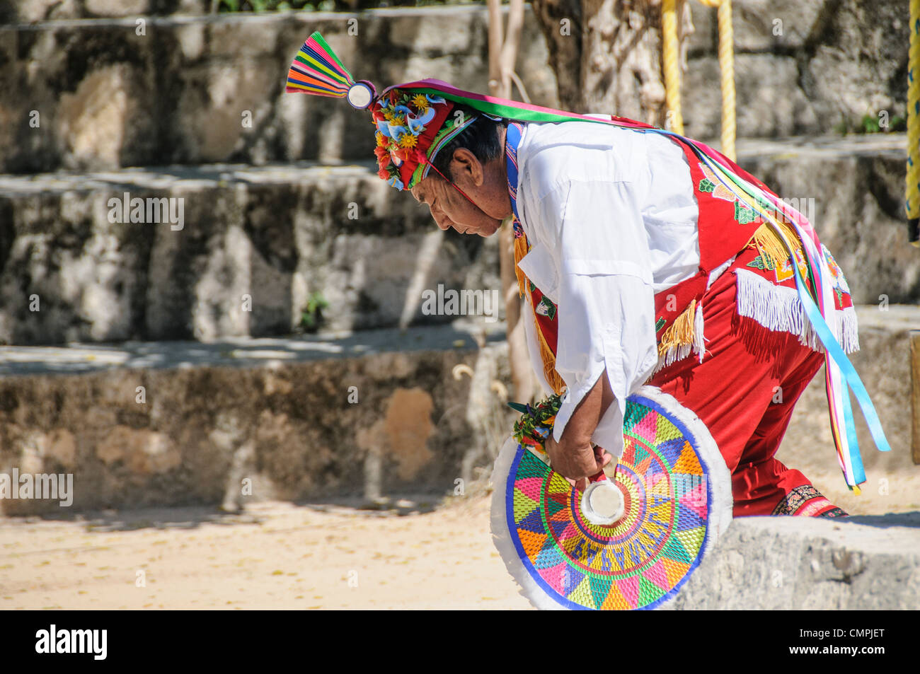 Traditional dancer in full costume performing a Maya dance at Xcarat Maya theme park south of Cancun and Playa del Carmen on Mexico's Yucatana Peninsula. Stock Photo