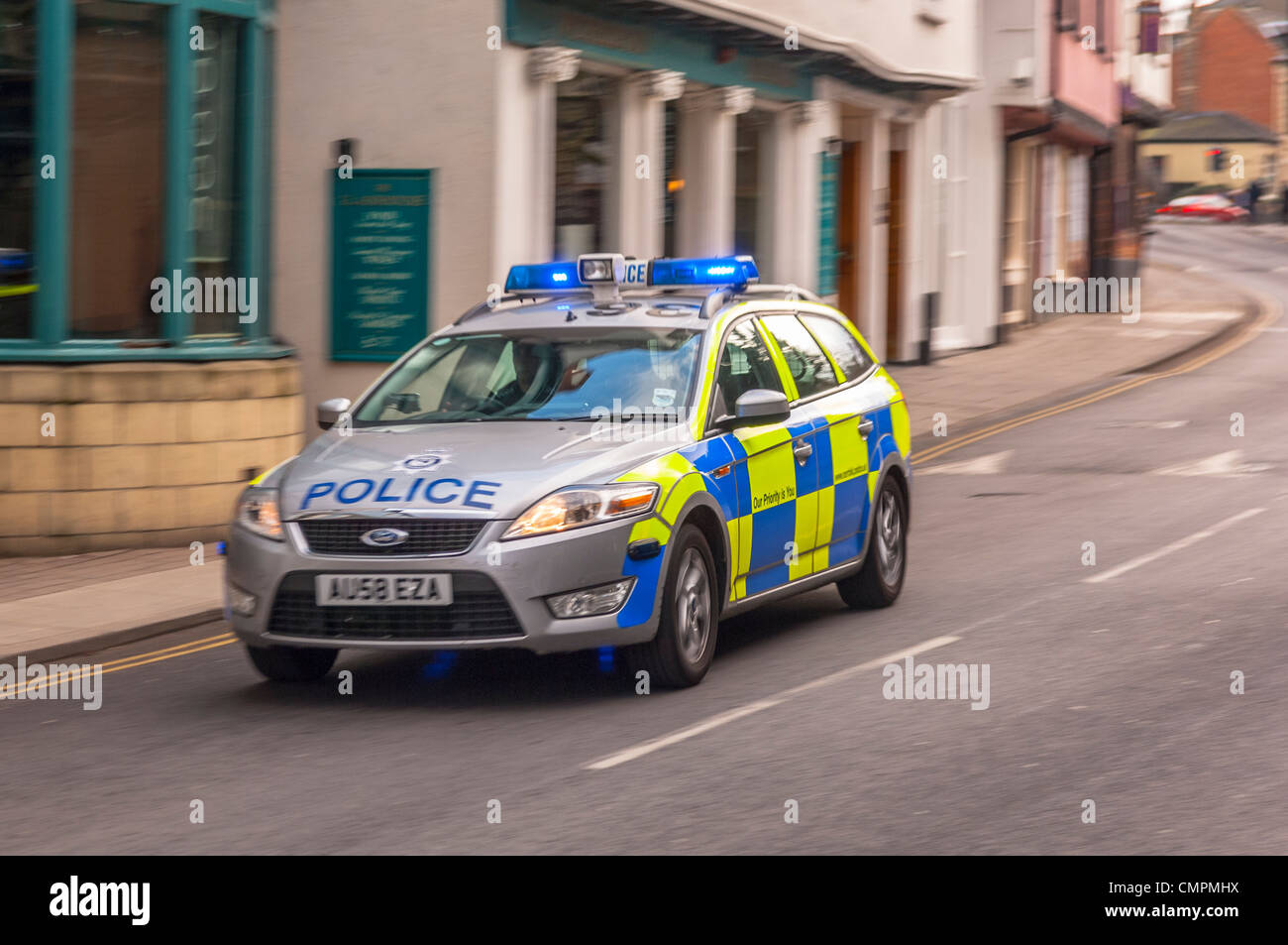 A Police car on a shout with blue lights flashing in Norwich , Norfolk , England , Britain , Uk Stock Photo