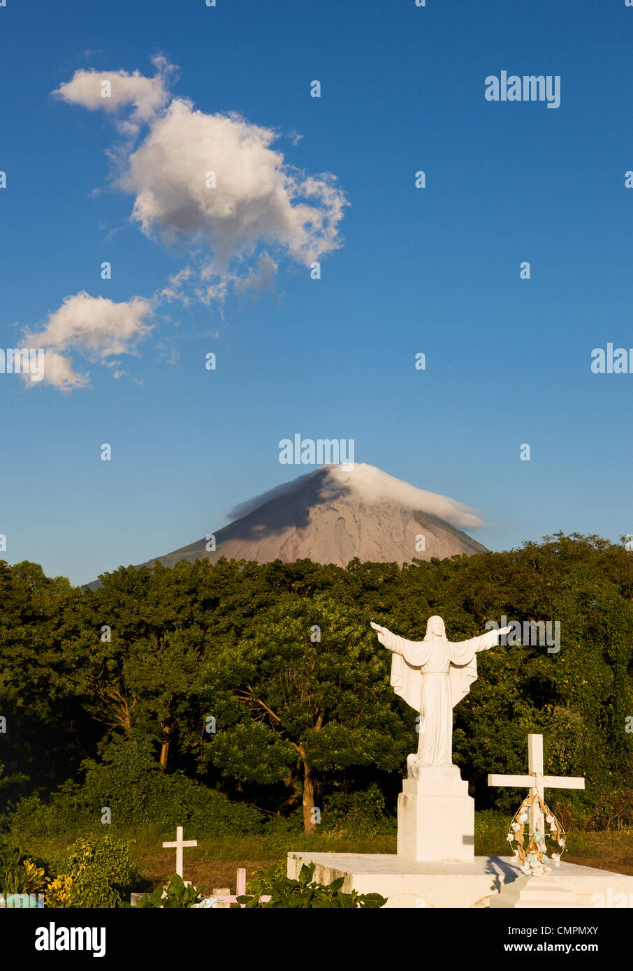 Graveyard and the Concepcion volcano on Ometepe island, Lake Nicaragua, Nicaragua, Central America Stock Photo