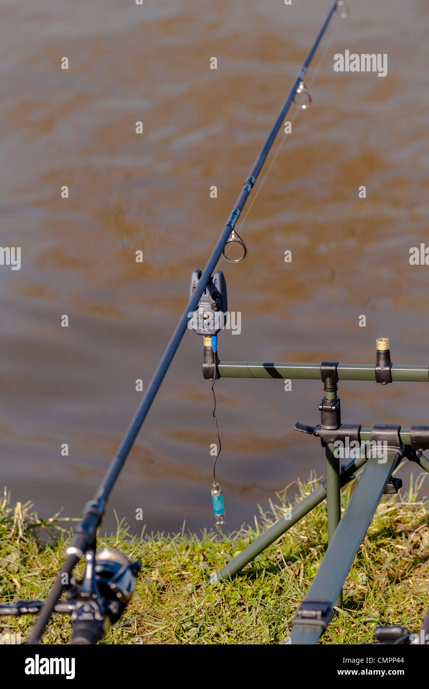 A radio optonic set up on a fishing rod to make an alarm noise when a fish  bites Stock Photo - Alamy