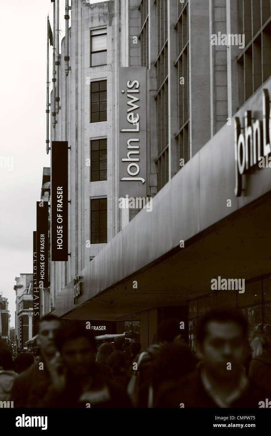 People walking passed John Lewis and House of Fraser department stores