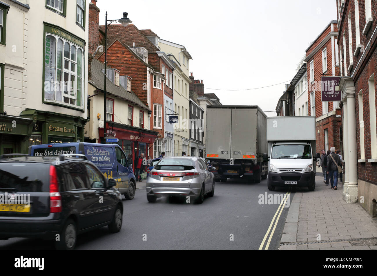 A van drives along the pavement in the congested town centre of Lewes, East Sussex Stock Photo