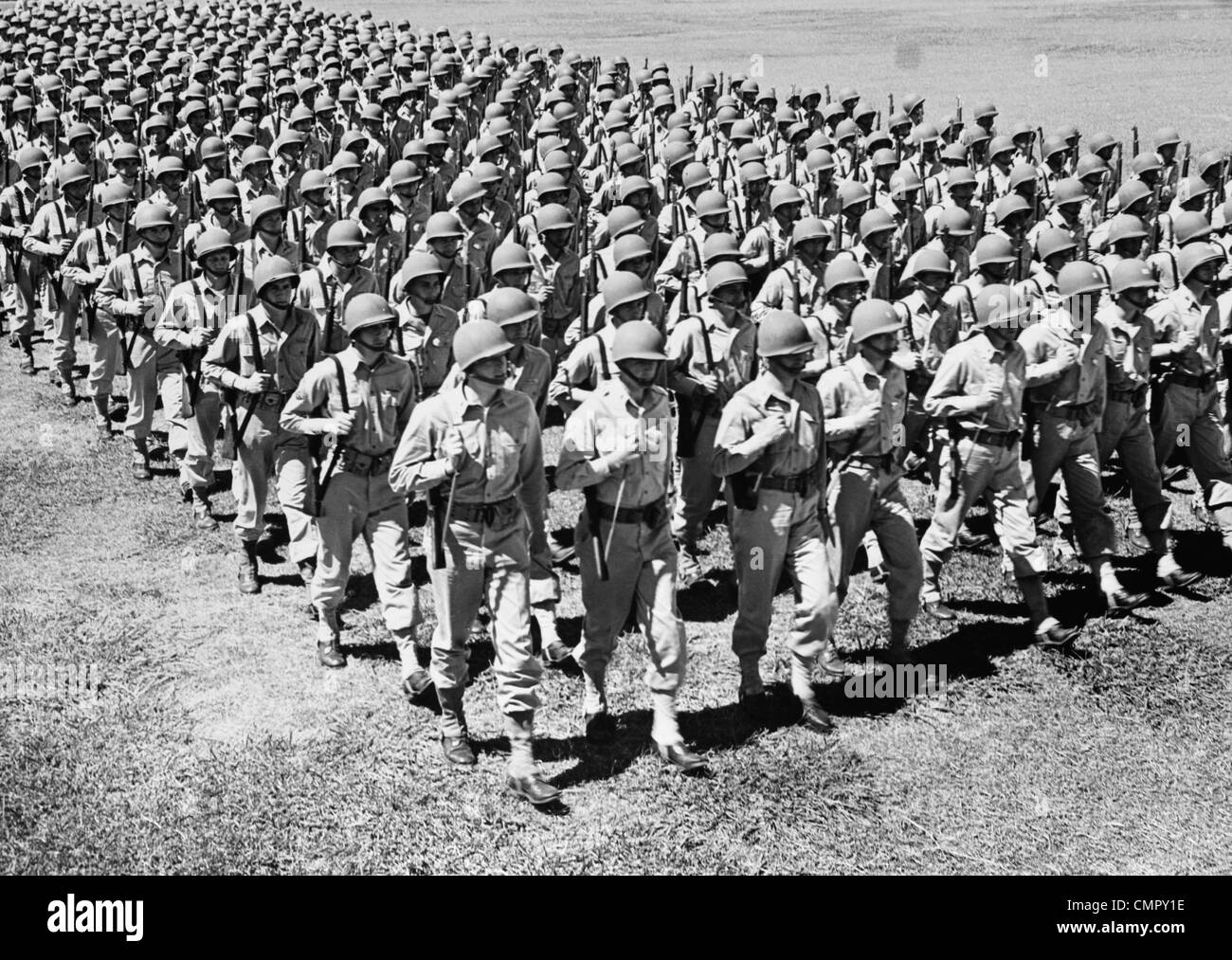1940s ROWS OF USA INFANTRYMEN MARCHING Stock Photo