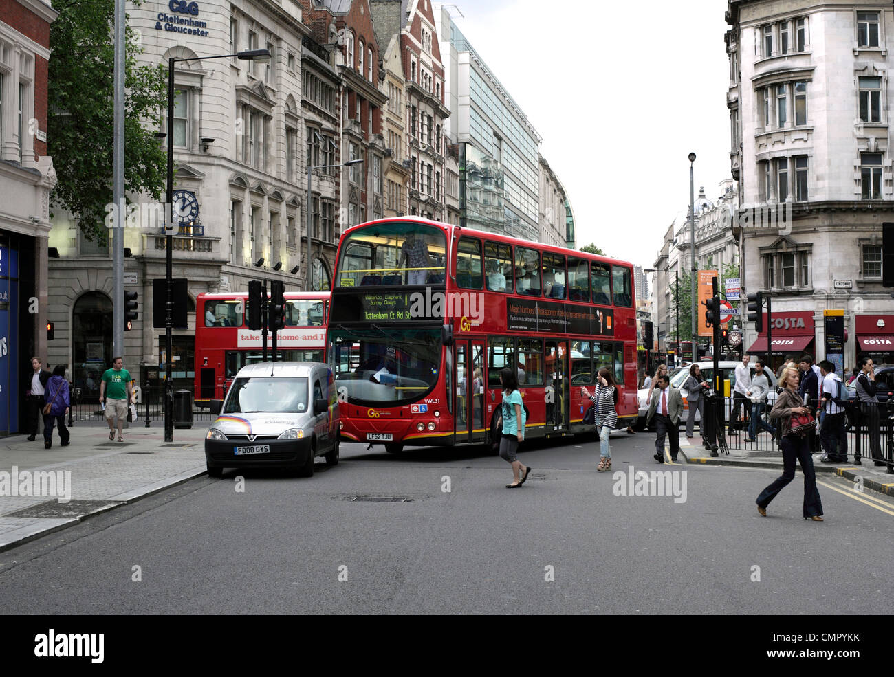 A London bus unable to turn and held up by an illegally parked van, High Holborn, central London. Stock Photo