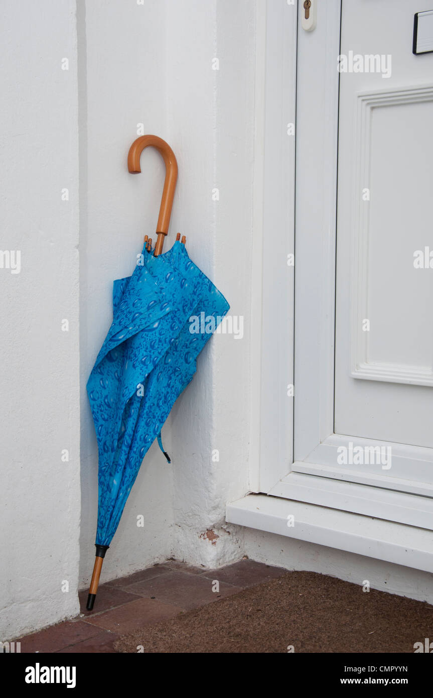 Umbrella outside front door of an English home. Stock Photo