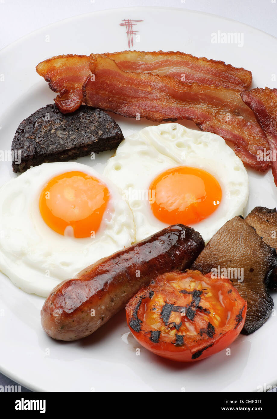 full English breakfast fry up egg and bacon restaurant unhealthy food greasy spoon Stock Photo