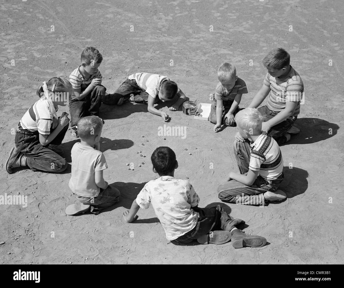 1950s BOYS & GIRLS SHOOTING MARBLES Stock Photo - Alamy