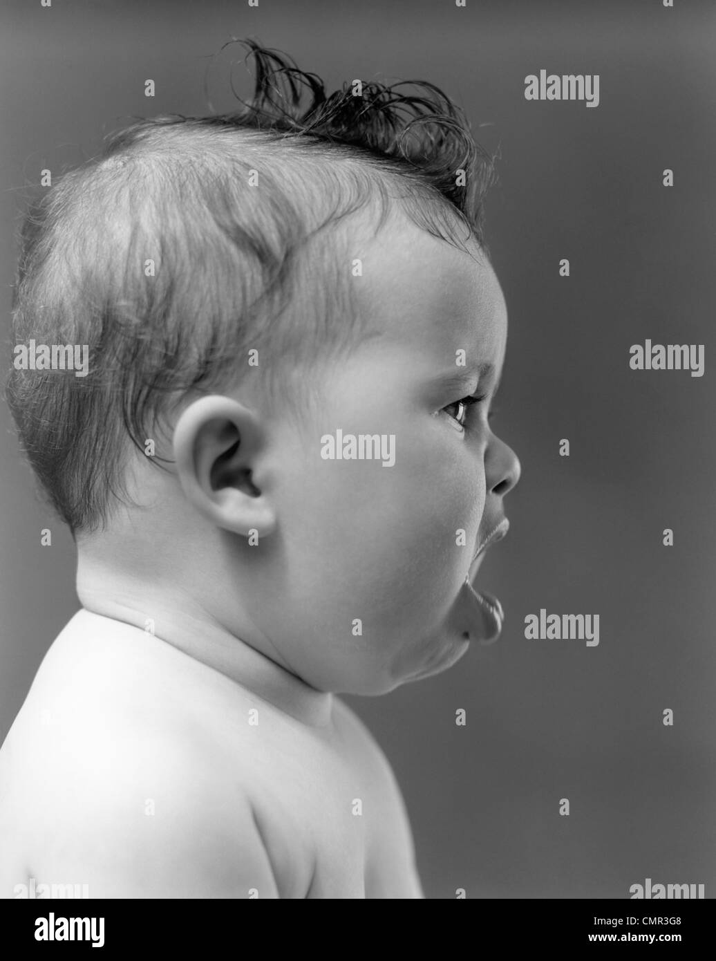 1940s 1950s Profile Of Baby Head With Mouth Open Indoor Stock Photo Alamy