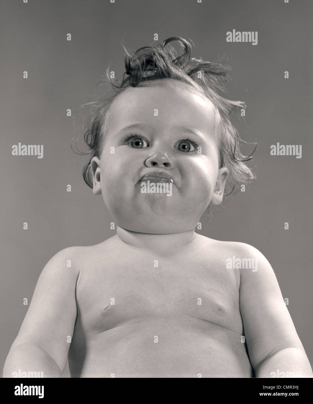1950s PORTRAIT BABY WITH MESSY HAIR & PURSED LIPS Stock Photo Alamy
