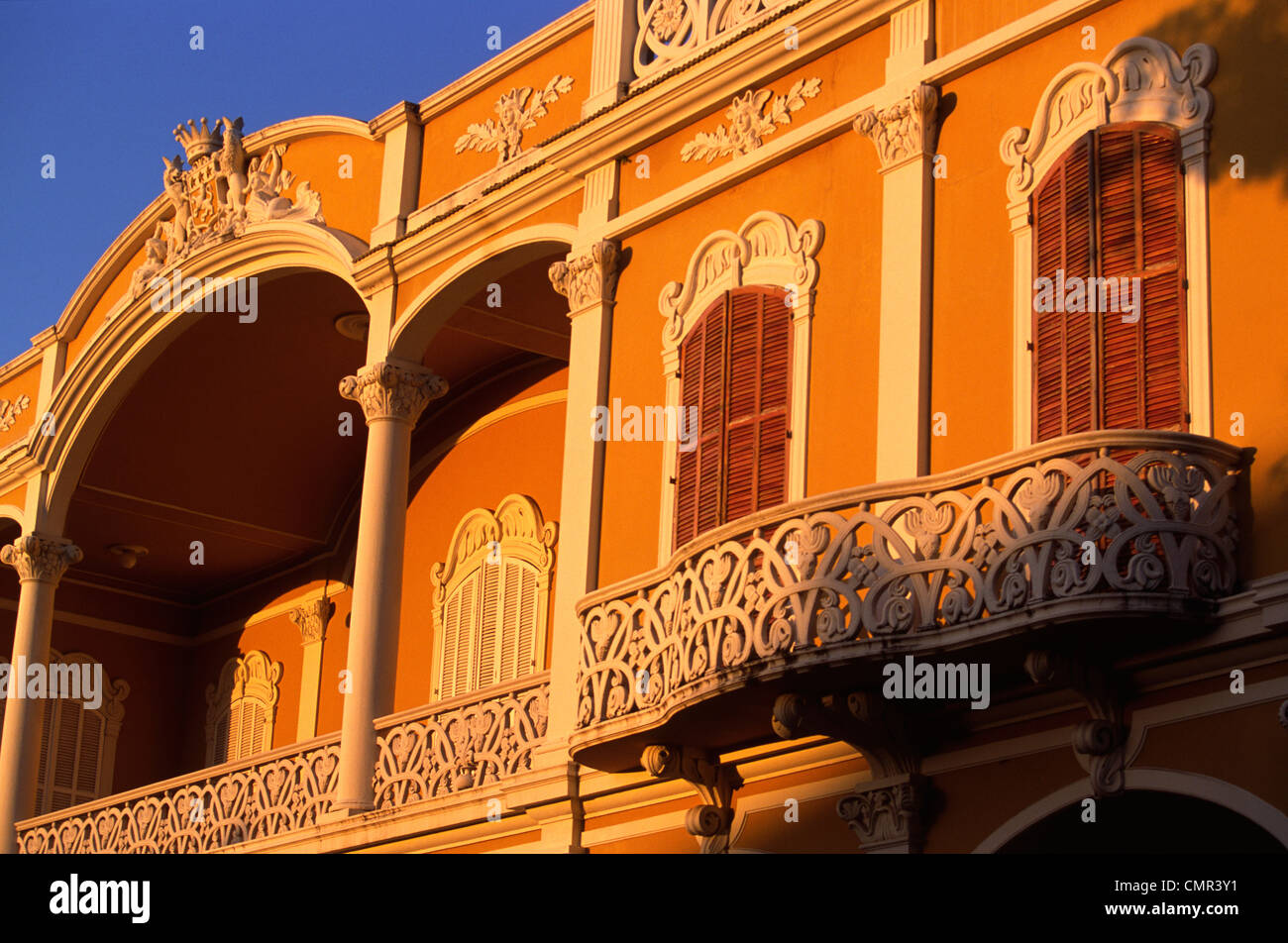 Arches and stone work from the colonial era on the front of the main cathedral in the square in Granada, lit by the morning sun Stock Photo