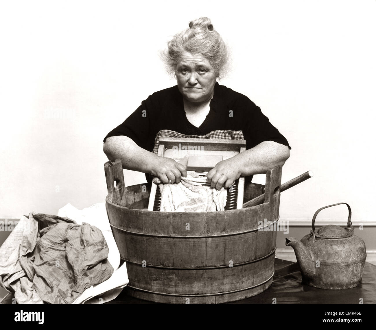 https://c8.alamy.com/comp/CMR46B/1920s-1930s-1940s-senior-woman-washing-clothes-in-old-fashioned-wooden-CMR46B.jpg