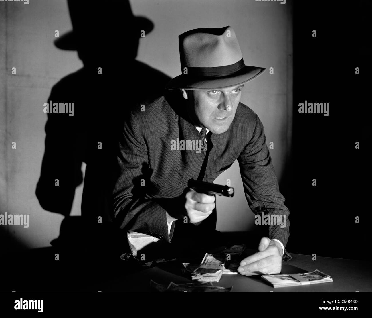 1940s MAN GANGSTER STEALING MONEY AT GUNPOINT CRIME Stock Photo - Alamy