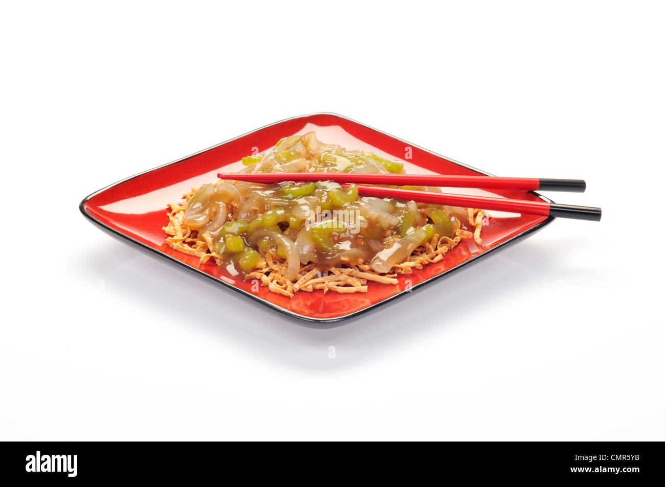Plate of Chinese vegetable chow mein on red plate with chopsticks Stock Photo