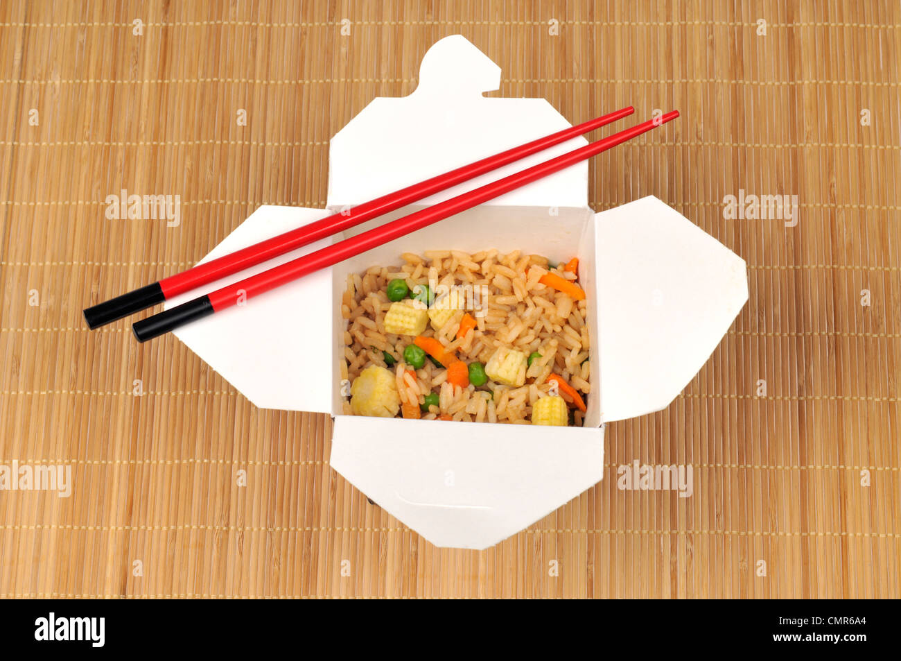 Box of chinese shrimp fried rice with chopsticks Stock Photo