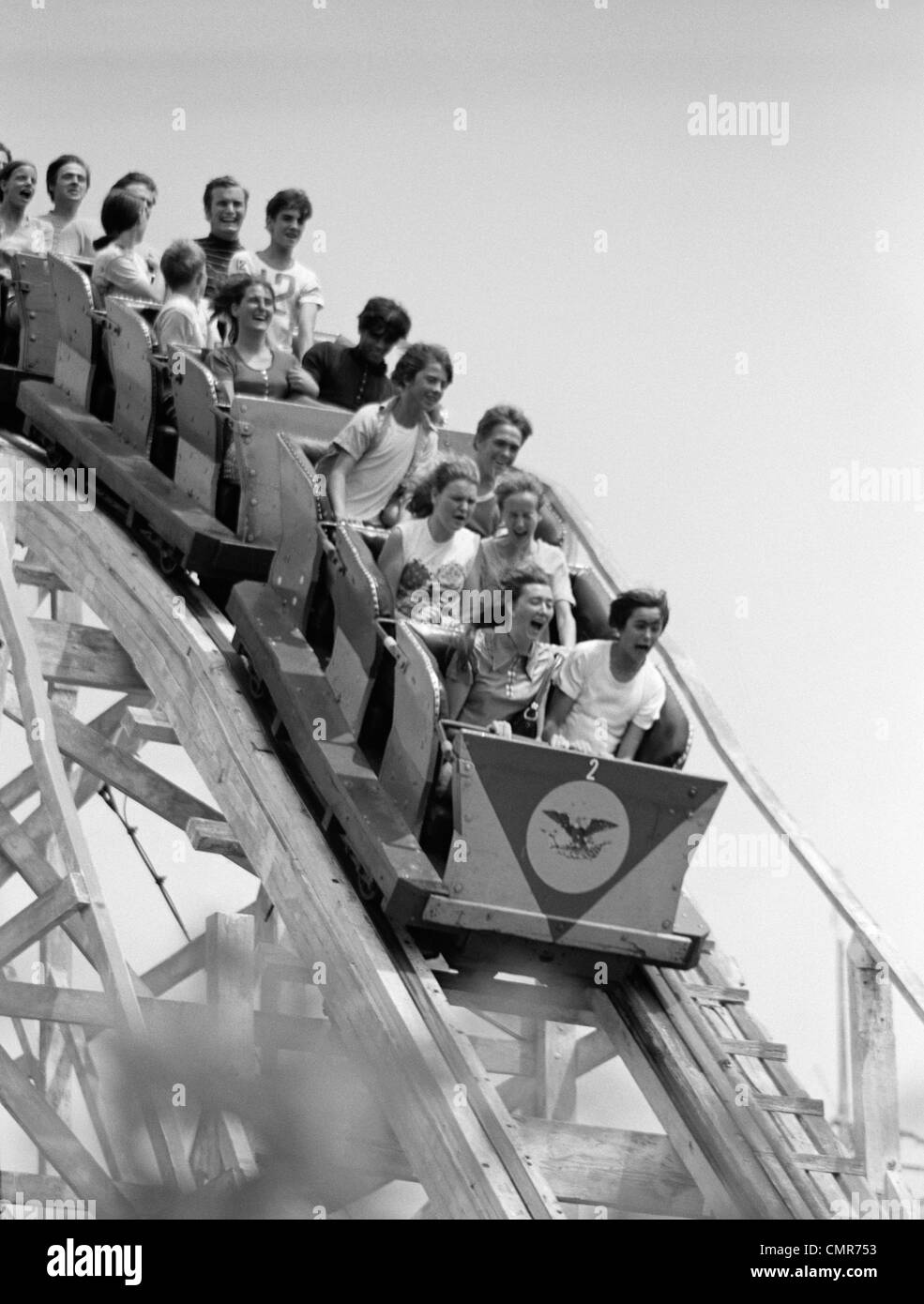 1960s ROLLER COASTER STARTING TO GO DOWN HILL Stock Photo