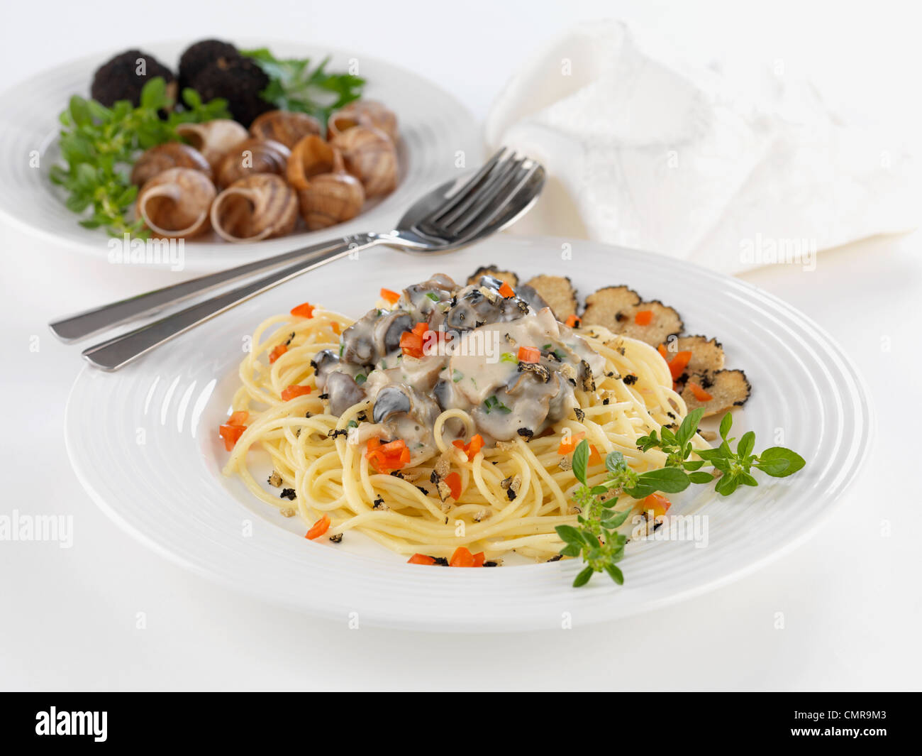 snail ragout and pasta Stock Photo