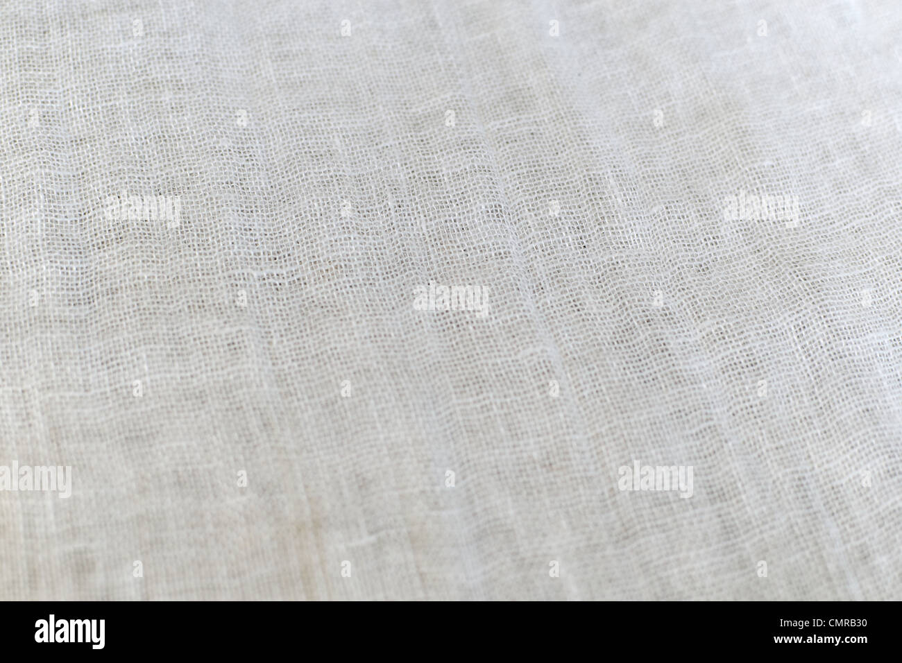 Woven fabric made from natural linen and silk. Natural material. Select focus. Stock Photo
