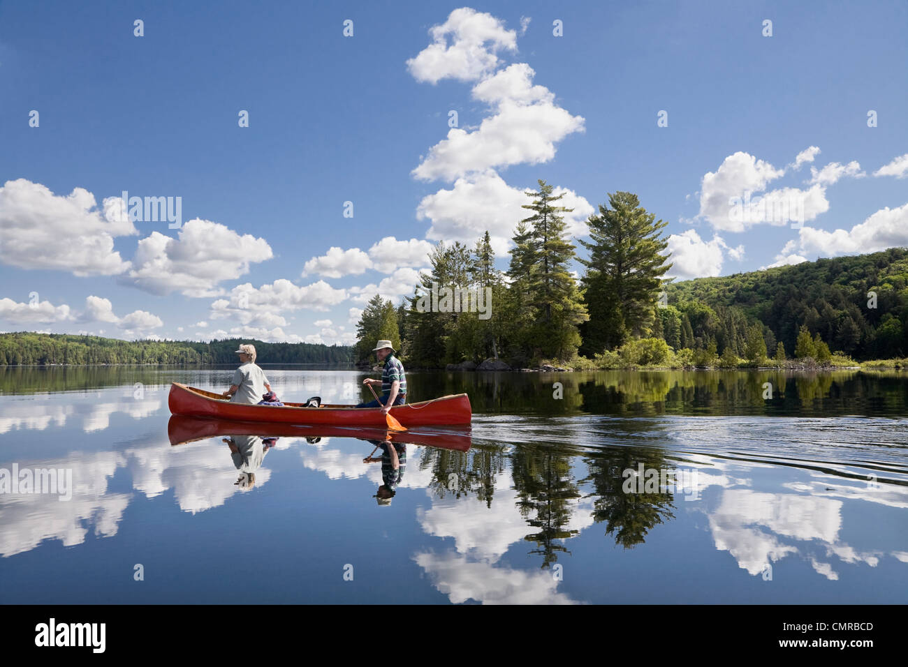 Senior couple canoeing on Smoke Lake, Algonquin Park, Ontario Stock Photo