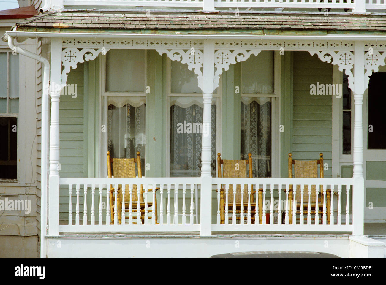 1980s WHITE PAINTED WOOD PORCH WITH WICKER ROCKING CHAIRS SUMMER