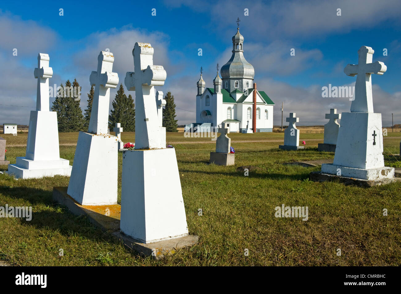 Ukrainian Orthodox Church and gravestones, Insinger, Saskatchewan Stock Photo