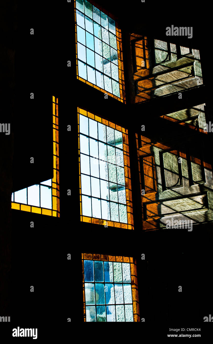 Play of light coming through the shuttered windows of the Chateau Montgommery in Ducey, France. Stock Photo