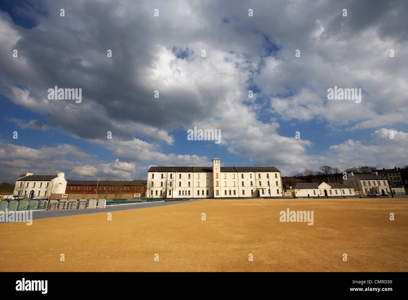 soldiers quarters with clock tower and parade ground in ebrington square former ebrington barracks british military base Derry c Stock Photo