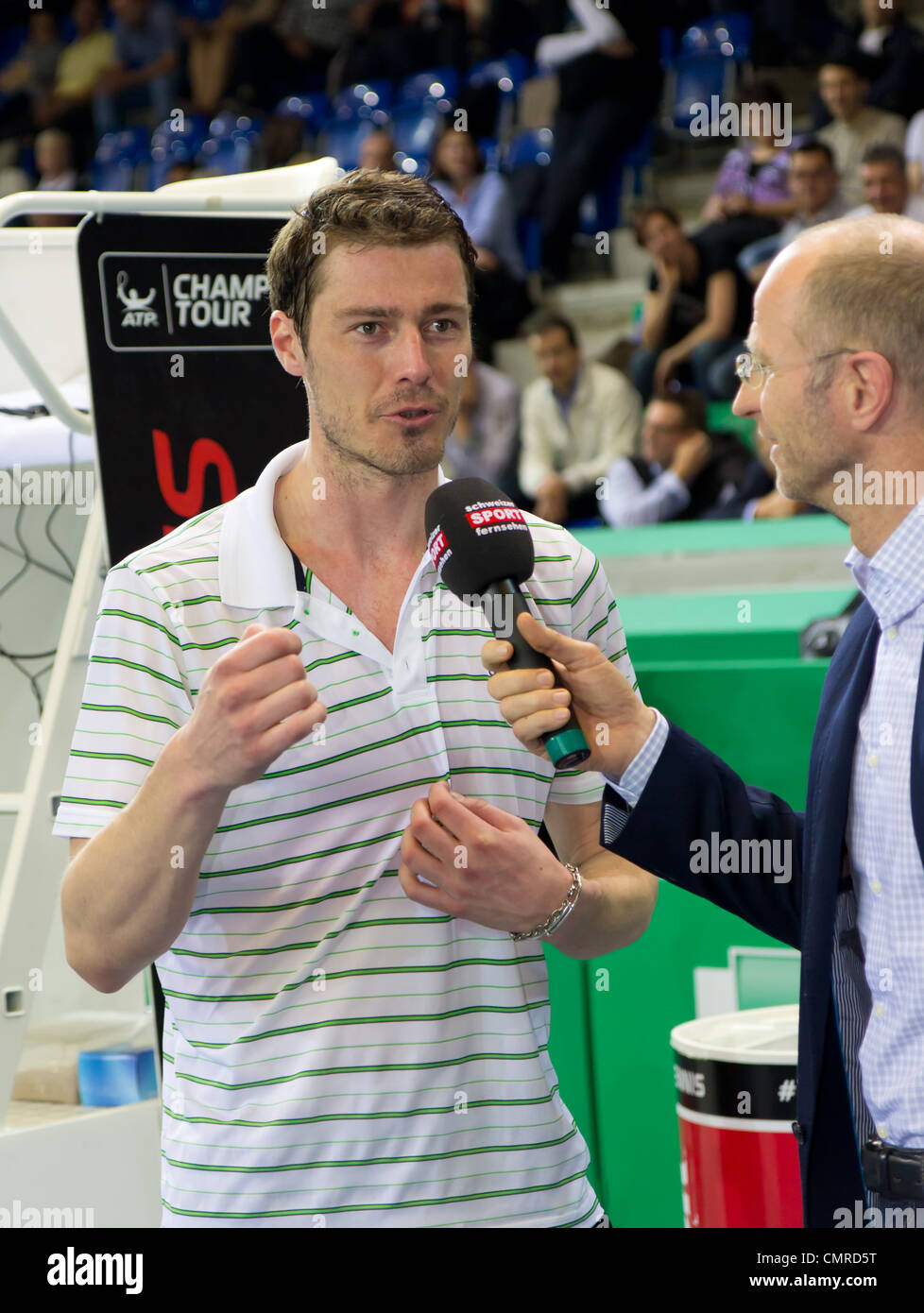 Marat Safin (l.) gives interviews after the 3rd place match against Mark Philippoussis which he lost at BNP Paribas Open Stock Photo