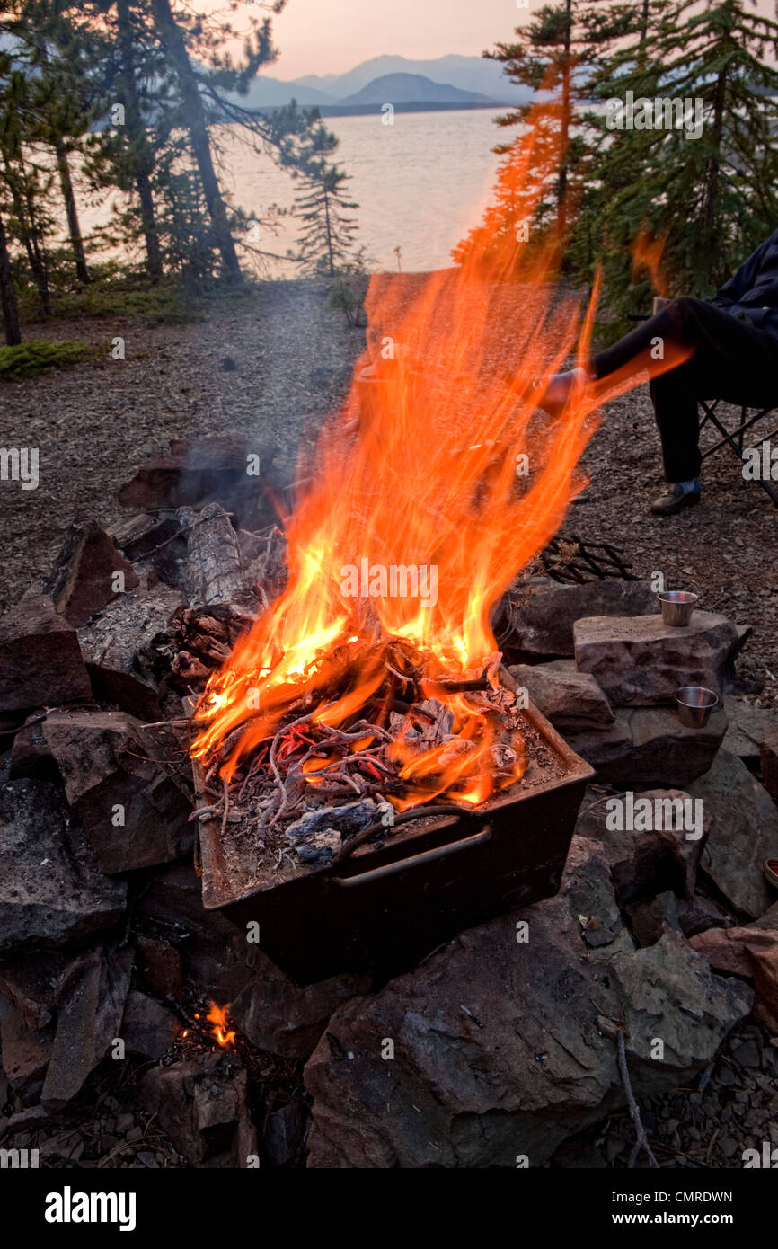 Using a dutch oven to cook brownies while camping Stock Photo Alamy