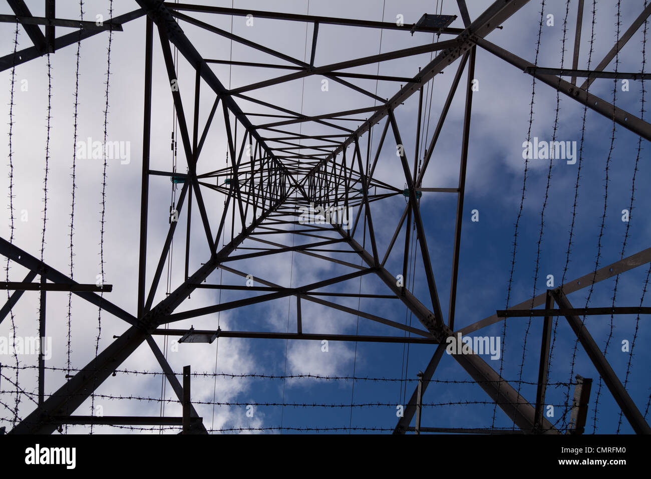 Looking up at an electricity pylon in the upper Spey along the route of the proposed Beauly Denny 400kV overhead powerline route Stock Photo