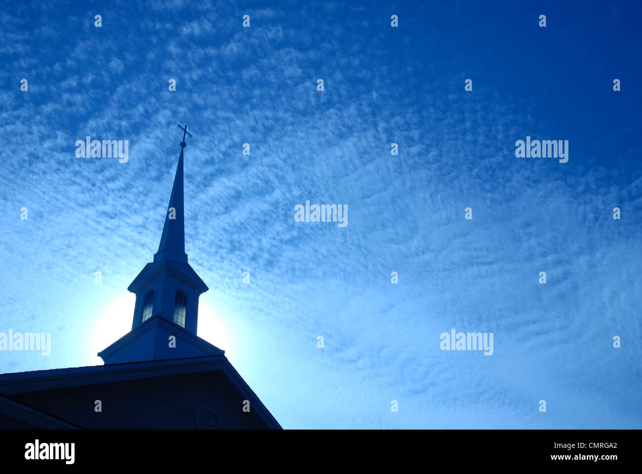 Church steeple against a sunrise sky. Stock Photo