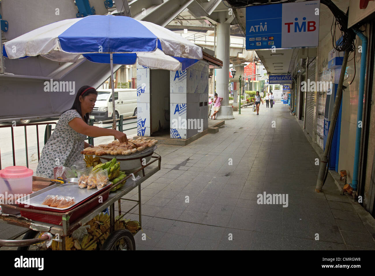 Thailand Bangkok Street trader cooking and frying banana Stock