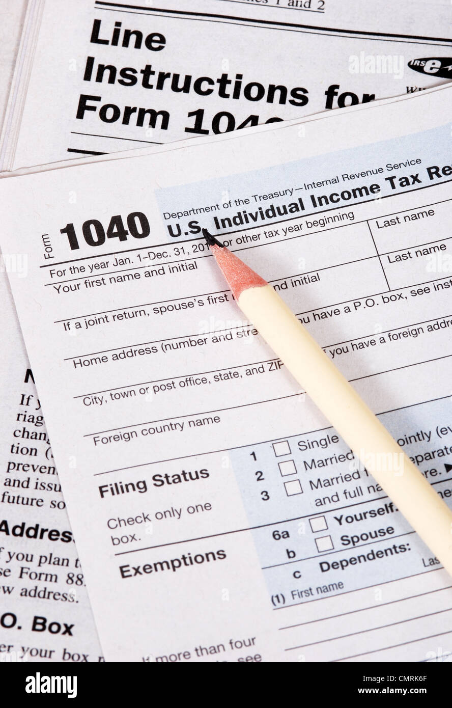 Close up of United States tax form, instruction book and pencil Stock Photo