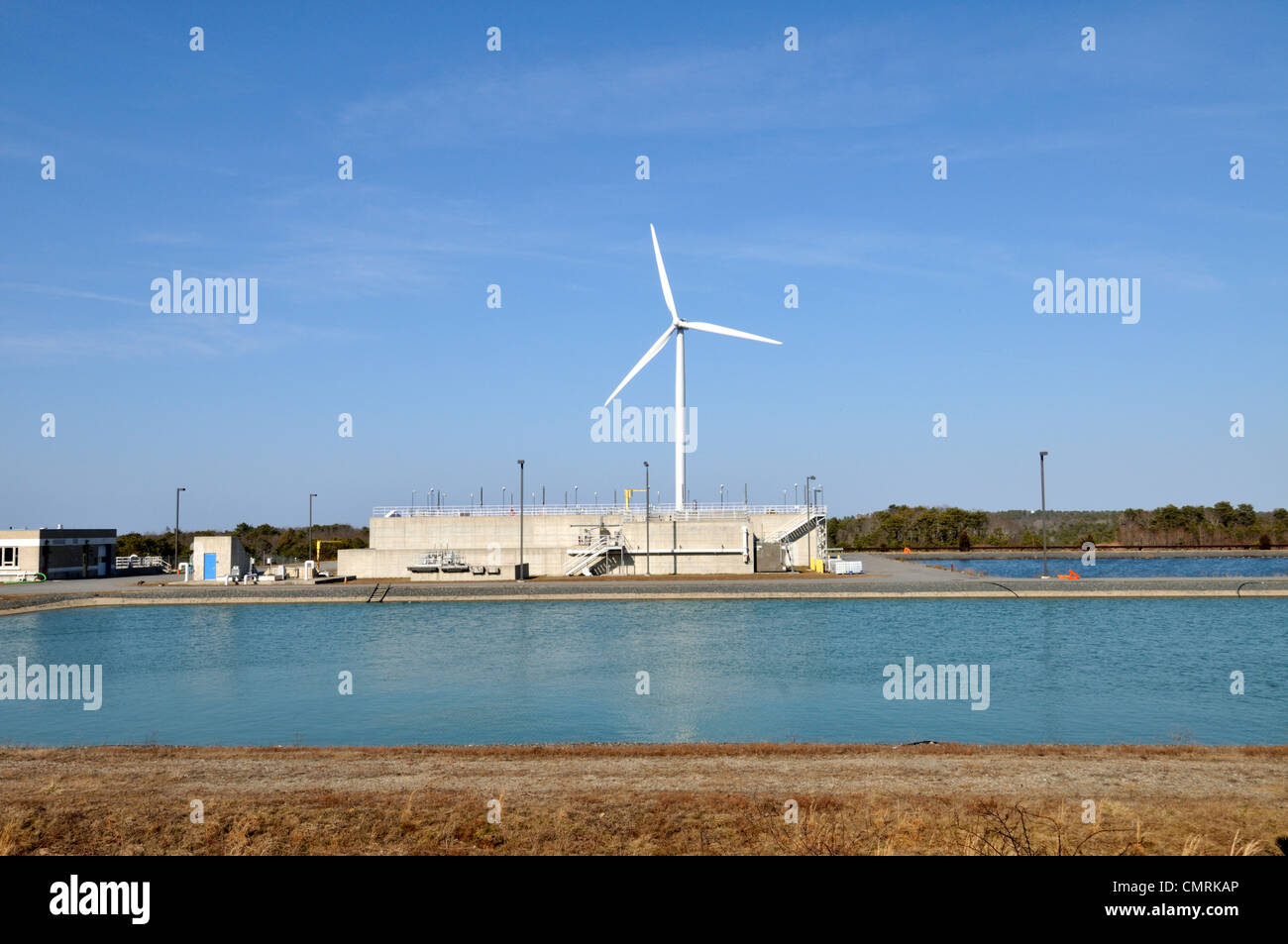 Wind turbine at wastewater treatment facility in Falmouth, Cape Cod, Massachusetts, USA Stock Photo