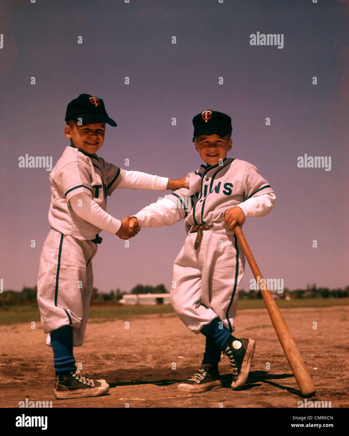 1960 1960s BOYS PLAYING BASEBALL SHAKING HANDS BAT UNIFORM FRIENDS  FRIENDSHIP HAND SHAKE CHILDREN SPORTS SPORT BOY Stock Photo - Alamy