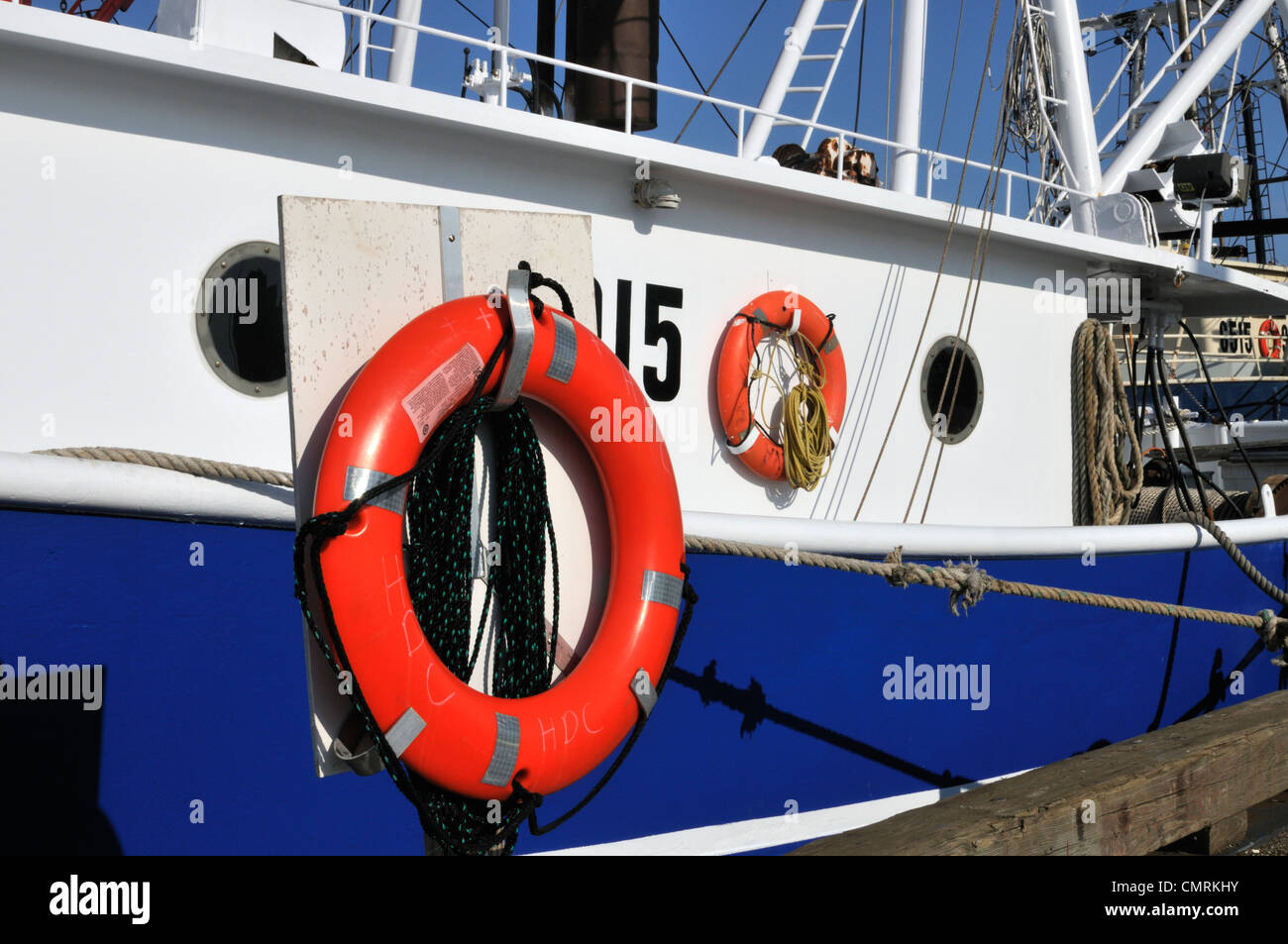 Orange life saving ring buoy on side of commercial fishing boat in Stock Photo 47234151 Alamy