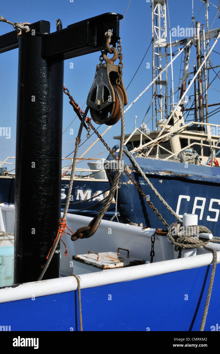 Block and tackle with steel cable aboard a fishing dragger docked in New Bedford, Massachusetts Stock Photo