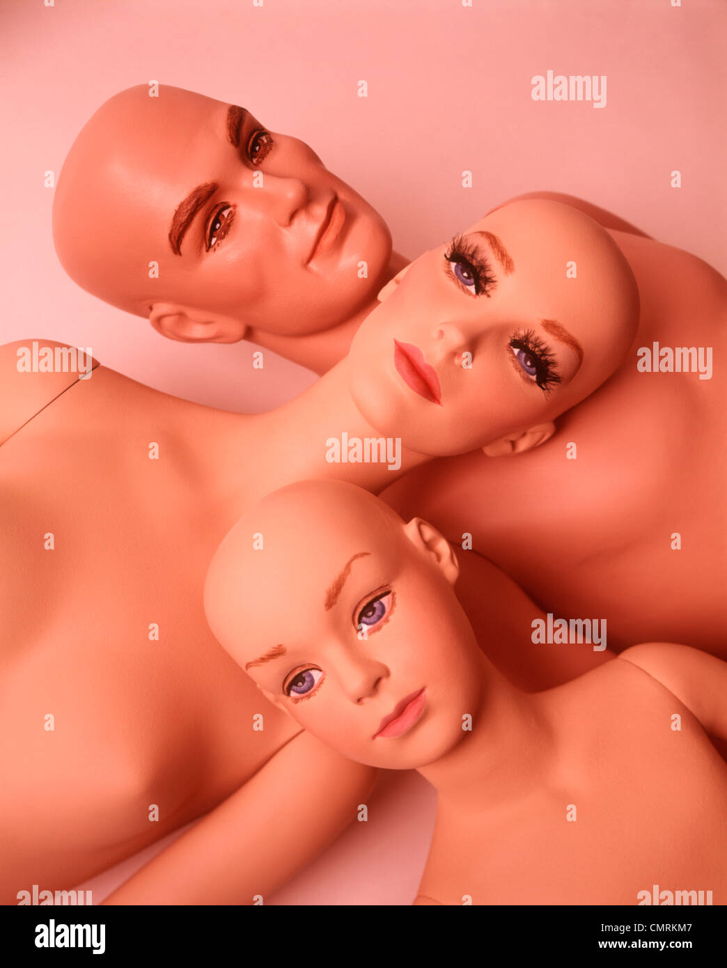 1970 1970s FAMILY 3 DUMMIES MANNEQUINS BALD STIFF MOTHER FATHER CHILD ALIENS CLONES WEIRD WACKY FUNNY DUMMY MODELS Stock Photo