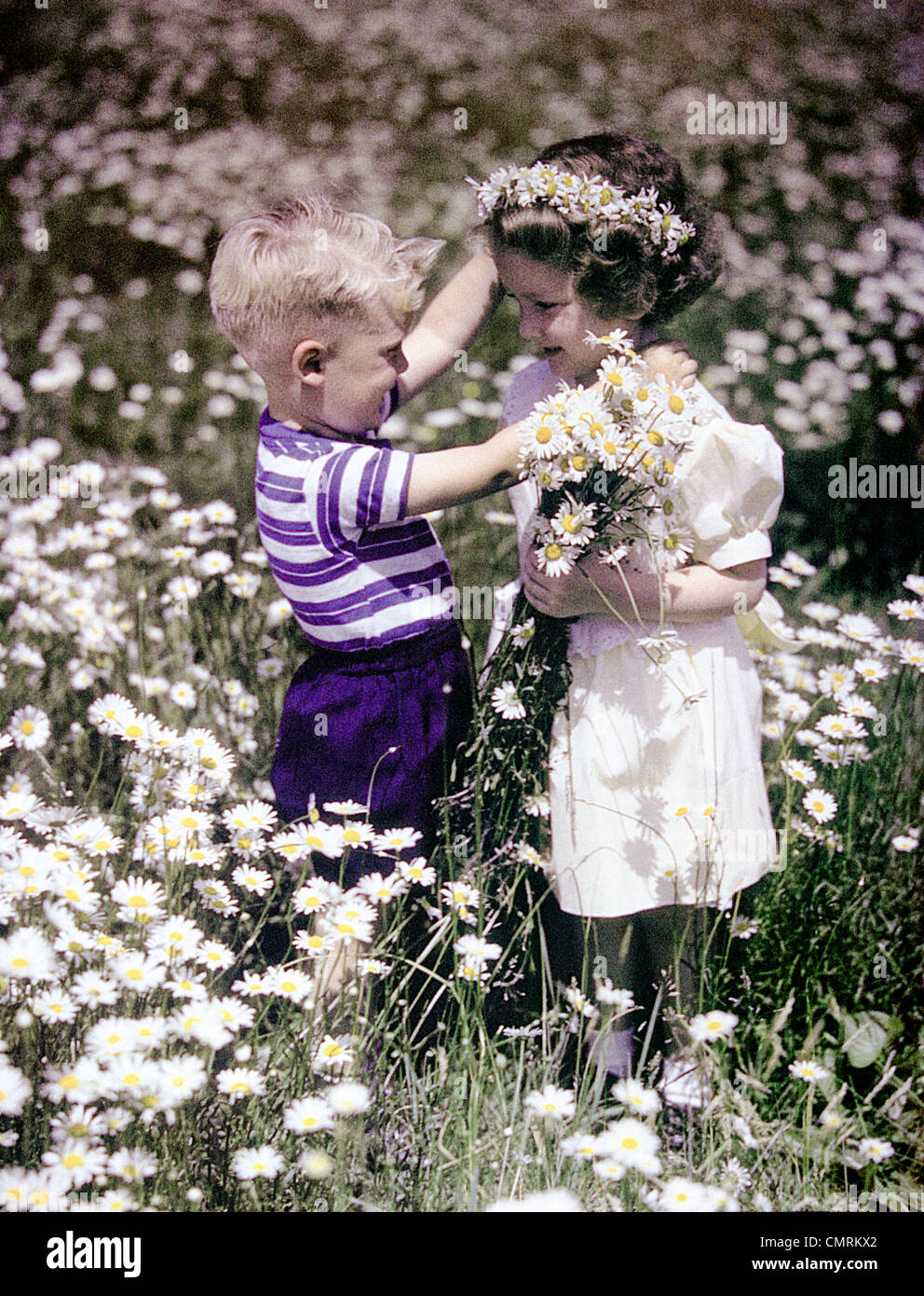 Retro children boy girl flowers hi-res stock photography and images - Alamy, image size:992x1390