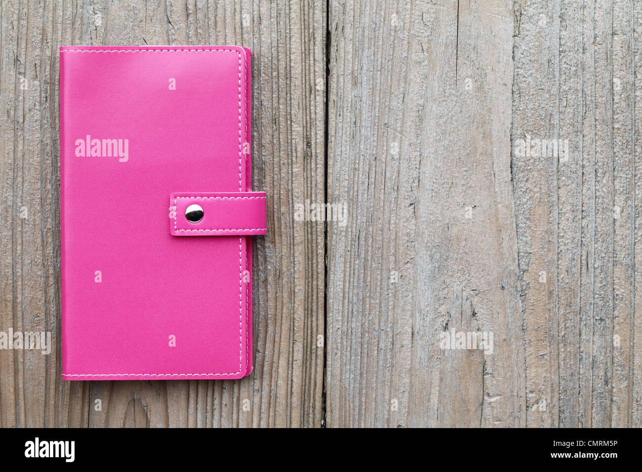 Leather organizer on wooden table Stock Photo