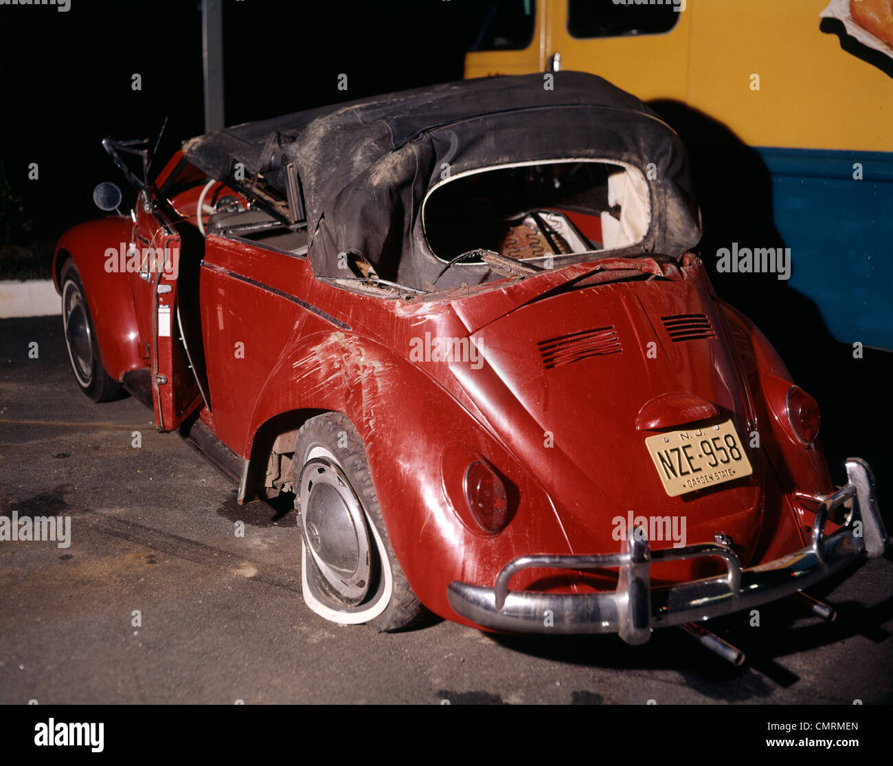 1960 1960s RED VOLKSWAGEN BUG BEETLE CAR CONVERTIBLE WRECK CRASH CRASHED WRECKED WRECKS RUIN DAMAGE RETRO ACCIDENT Stock Photo